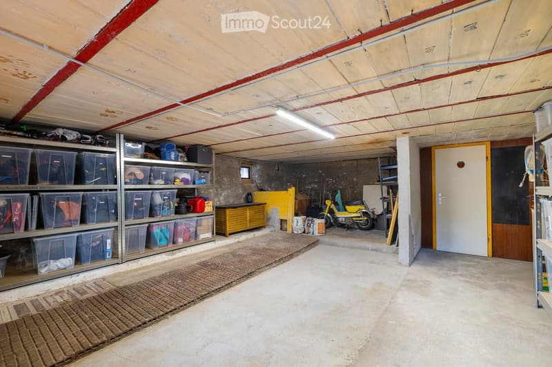 {"type": "Garage", "objects": ["shelves", "storage bins", "motorcycle", "cabinet", "mats"], "description": "Garage with metal shelving units filled with storage bins, a small yellow cabinet, a motorcycle, and a few mats on the floor.", "localized_descript