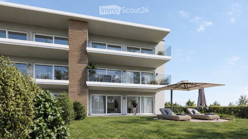 Modern two-story house with large windows, balconies, and a well-maintained lawn with outdoor seating and an umbrella.