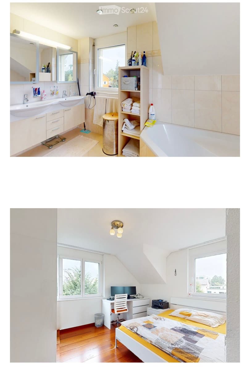 Modern bathroom with double sink, mirror, bathtub, and built-in cabinetry. Features tiled walls, a window, and various toiletries on the counter.
