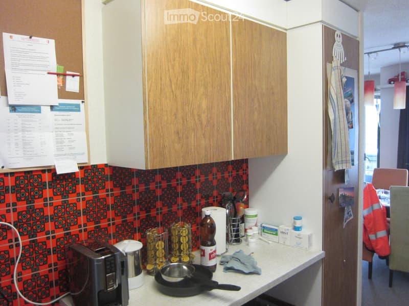 {"type": "Kitchen", "objects": ["microwave", "toaster", "frying pan", "cupboard", "bottle", "roll of paper towels", "cutting board", "cup", "bottle of water", "bottle of juice", "bottle of milk", "bottle of oil", "bottle of vinegar", "bottle of soda", "bo