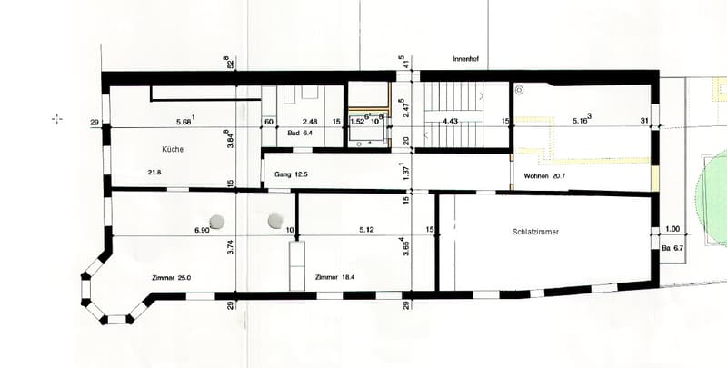 Floor plan of a residential space featuring a kitchen, living area, bedroom, hallway, bathroom, and an inner courtyard.