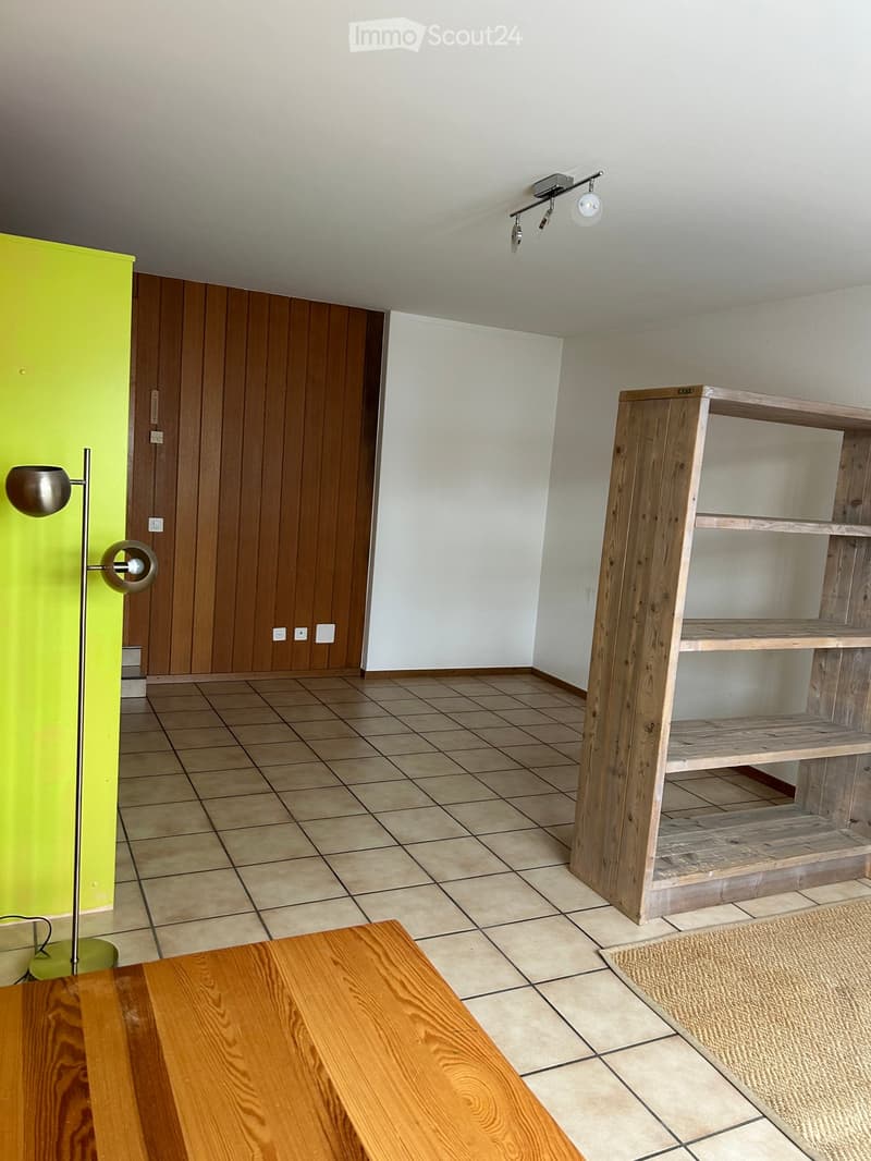 empty room, wooden door, wooden shelf, tiled floor, yellow wall, lamp