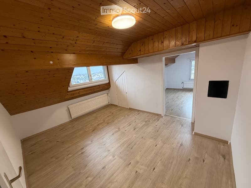 empty room, wooden floor, wooden ceiling, white walls, window, radiator, light