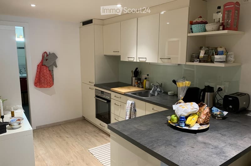 {"visible_features": [], "type": "Kitchen", "objects": ["oven", "sink", "faucet", "cutting board", "toaster", "cupboard", "fridge", "cupboard", "cupboard", "cupboard", "cupboard", "cupboard", "cupboard", "cupboard", "cupboard", "cupboard", "cupboard", "cu
