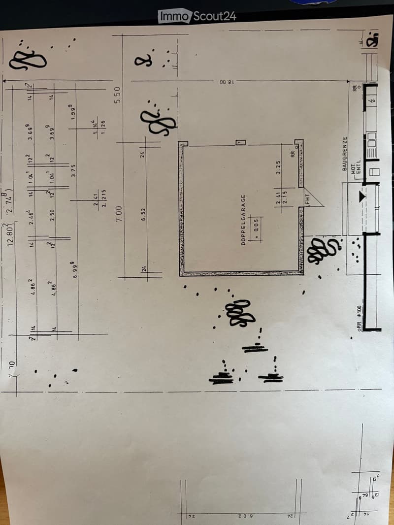 Floor plan showing a layout with labeled dimensions, including a double garage, entrance, and various room spaces.