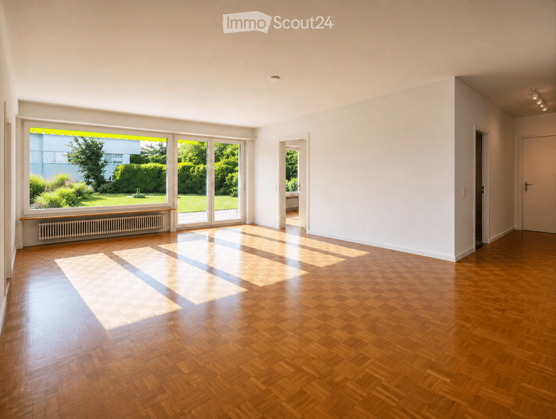 Empty room with wooden herringbone flooring, large windows with blinds, white walls, and a radiator under one window.