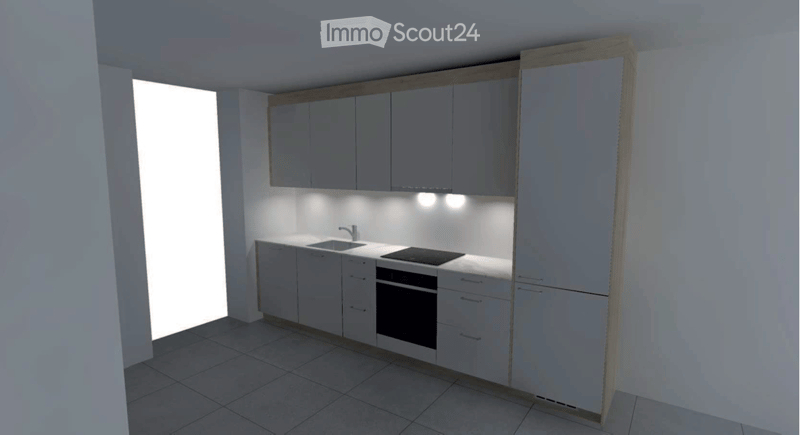 Modern kitchen with white cabinets, a sink, stove, and oven. The space is well-lit with built-in lighting under the cabinets.