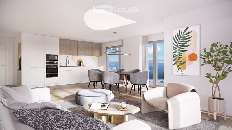 Modern open-plan living and dining area with a view, featuring a white sofa, coffee table, ottoman, dining table with chairs, and a kitchen area with white cabinets and stainless steel appliances.