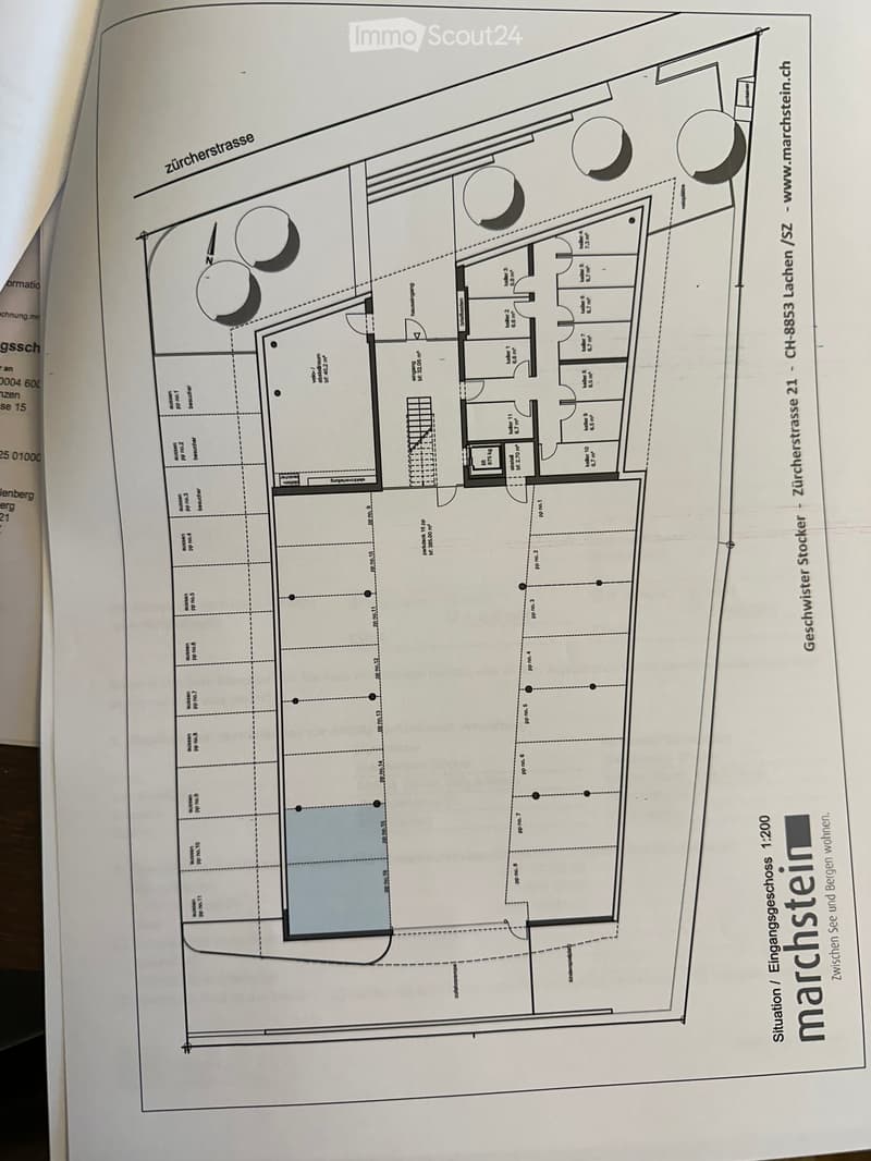 Floor plan of a two-story building showing layout with labeled rooms and dimensions, including entrance, living area, bedrooms, bathrooms, and outdoor spaces.