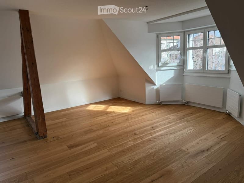 empty room, wooden floor, white walls, radiators, wooden beams, large windows