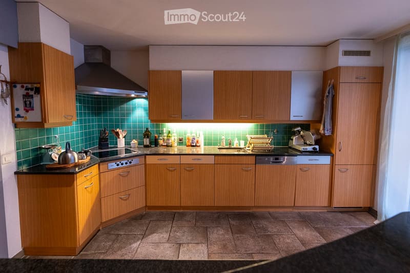 {"type": "Kitchen", "objects": ["cabinets", "stove", "dishwasher", "fridge", "oven", "sink", "faucet", "teapot", "cutting board", "bottle", "cup", "oven hood", "oven", "fridge", "oven", "oven", "oven", "oven", "oven", "oven", "oven", "oven", "oven", "oven