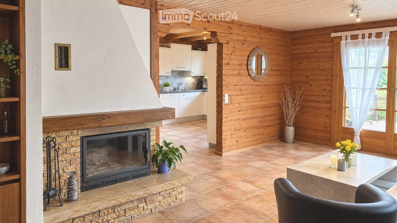 Open-plan living and dining area with exposed wooden beams, a stone fireplace, a modern kitchen, and large windows with white curtains.