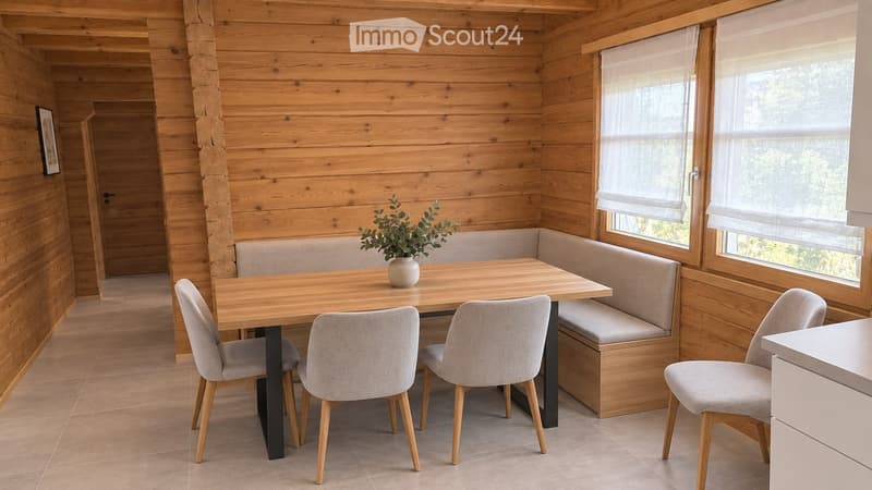Wooden dining area with a table, four chairs, a built-in bench, and a small vase with greenery on the table.