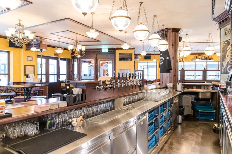 {"type": "Furnished Room", "objects": ["bar counter", "beer taps", "glasses", "stool", "table", "chair", "light fixture", "kitchen sink", "faucet", "cupboard", "stool", "stool", "stool", "stool", "stool", "stool", "stool", "stool", "stool", "stool", "stoo