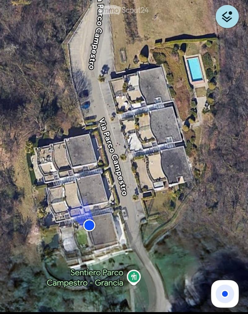 Cluster of buildings, driveway, swimming pool, open area