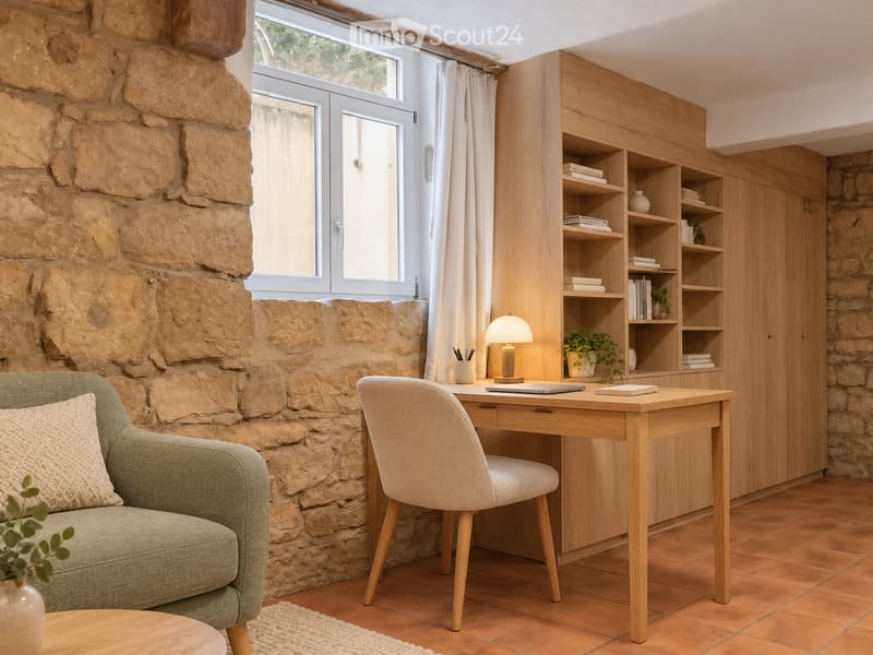 A cozy, well-furnished room with a stone wall, a wooden desk, a comfortable sofa, and a bookshelf filled with books and decorative items.