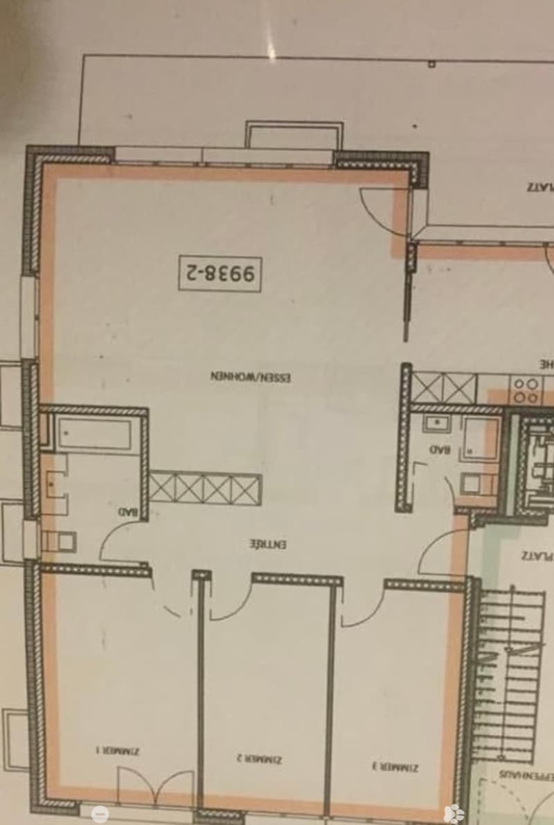 Floor plan of a residential unit showing a living room, kitchen, three bedrooms, two bathrooms, and a balcony.
