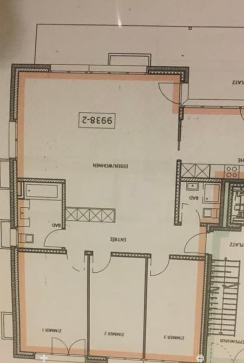 Floor plan of a residential unit showing a living room, kitchen, three bedrooms, two bathrooms, and a balcony.