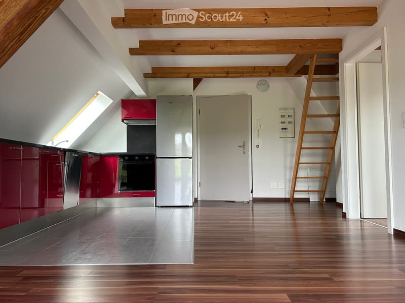 modern empty kitchen with wooden floor, red cabinets, a fridge, oven, dishwasher and wooden ceiling beams
