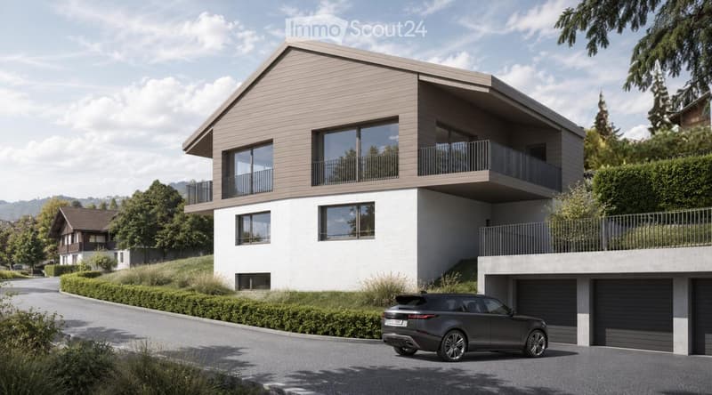 Modern two-story house with a combination of white and beige siding, large windows, balconies, and a garage. The house is situated in a landscaped area with greenery and a parked car in front.
