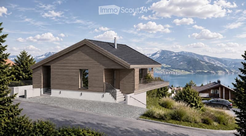 Modern two-story house with wooden facade, large windows, and a balcony overlooking a scenic lake and mountain view.