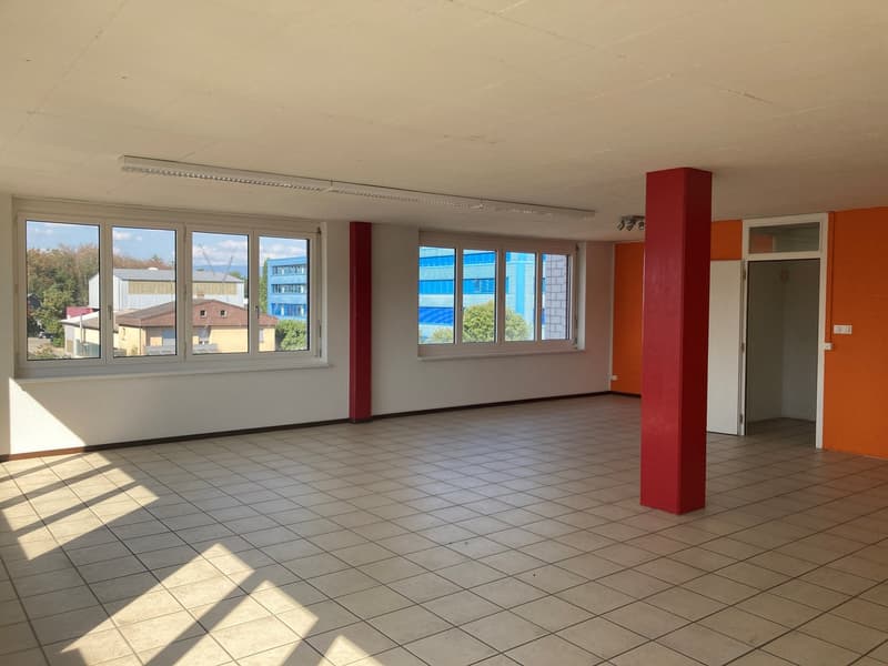 empty room, white tiled floor, white walls, windows, orange accent wall, red column