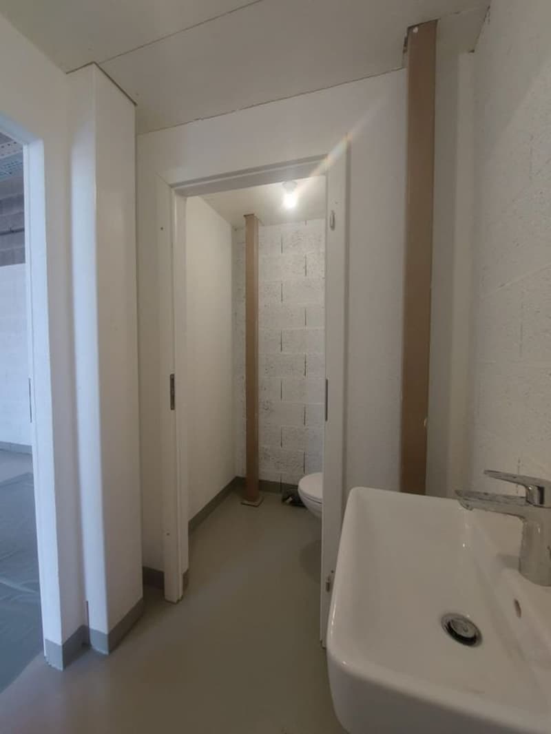 empty room, sink, open door, light on