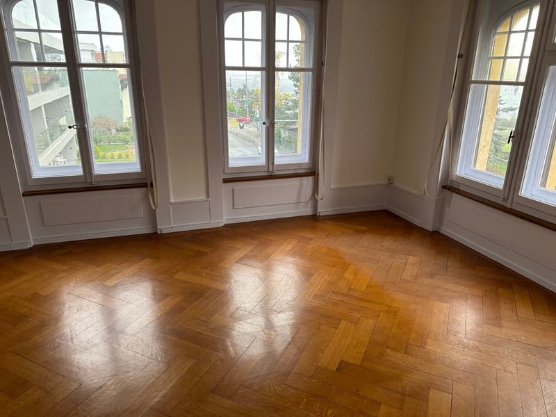 empty room, parquet flooring, large windows, white walls, curtains