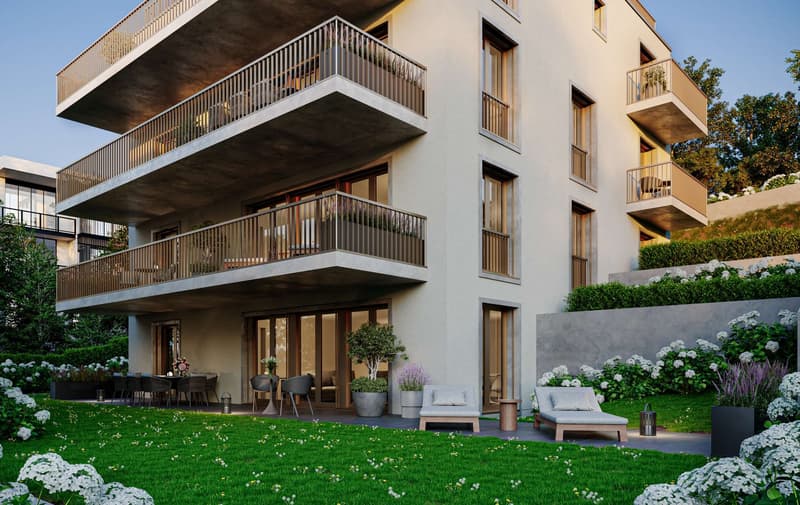Modern apartment building with multiple balconies, landscaped garden, outdoor seating area, and lush greenery