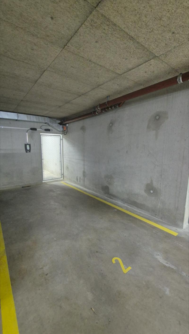 Parking space for rent in underground parking of a building in Eysins (2)