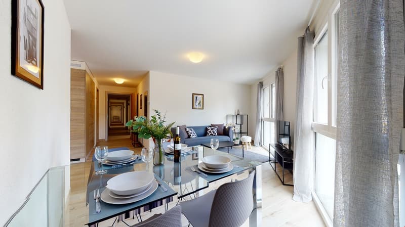 Dining table with four chairs, glass table, flower vase, bowl, wine glasses, forks, and knives
