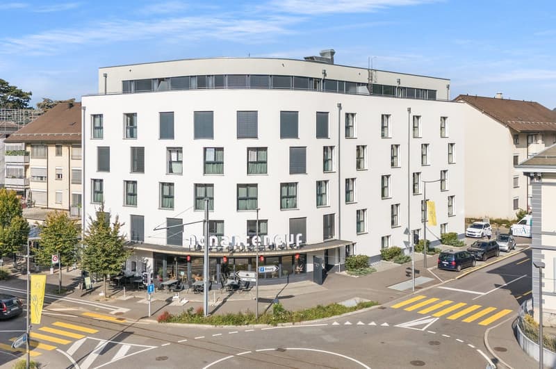 modern design building, ground floor commercial, apartment units above