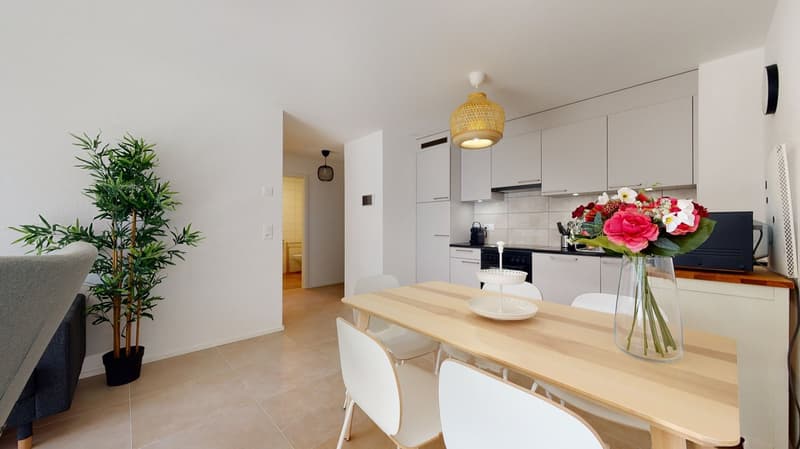 Modern interior, wooden dining table with chairs, potted plant, white cabinets, microwave, dining room table and chairs