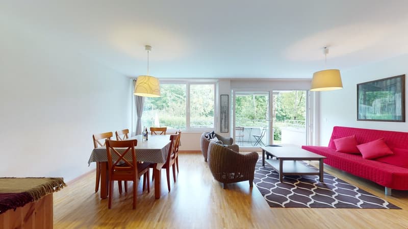 Dining area with table, chairs, coffee table, couch, rug, lamps