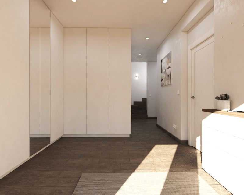 The image shows a spacious hallway with beige walls, dark hardwood flooring, and built-in cabinets along one wall. There is a framed artwork on the wall and a small potted plant on a shelf. The hallway leads to a staircase visible in the background.