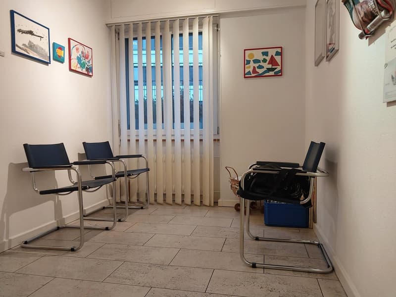 Interior with 3 steel chairs, white wall, white curtains, 5 pictures on wall, tiled floor