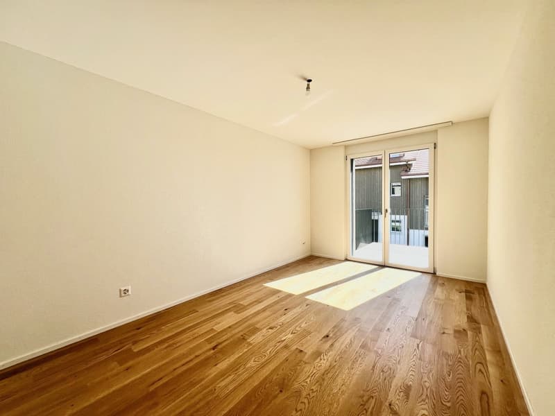 empty room, wooden floor, white walls, sliding glass door, balcony