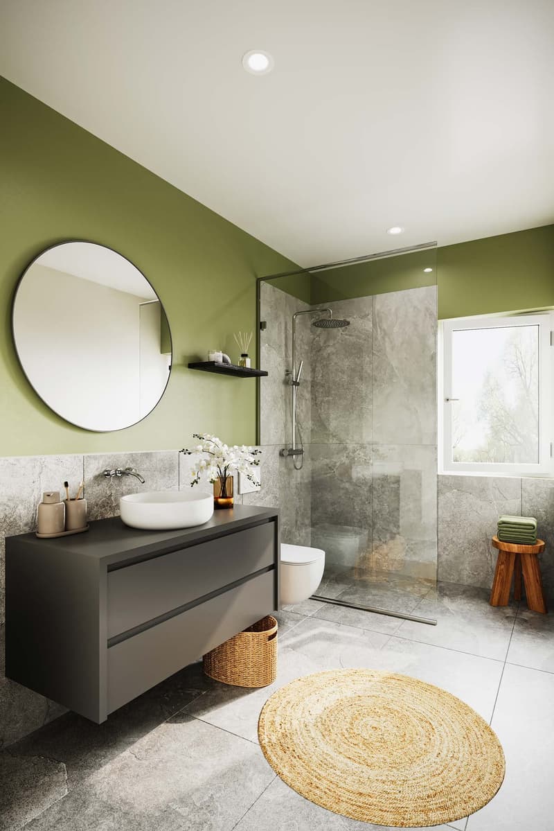 Bathroom with a sink, shower, toilet, round mirror, a round rug, wooden stool with towels