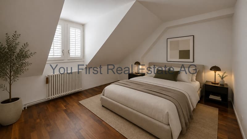 Dachgeschoss-Schlafzimmer mit Spitzbodencharme und Dachflächenfenstern