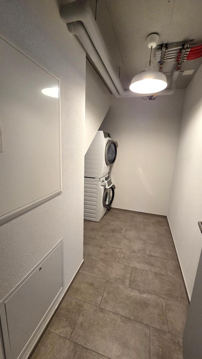 Laundry room with washing machine and dryer
