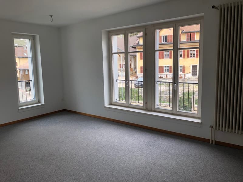 empty room, white walls, gray carpet, 2 windows, balcony