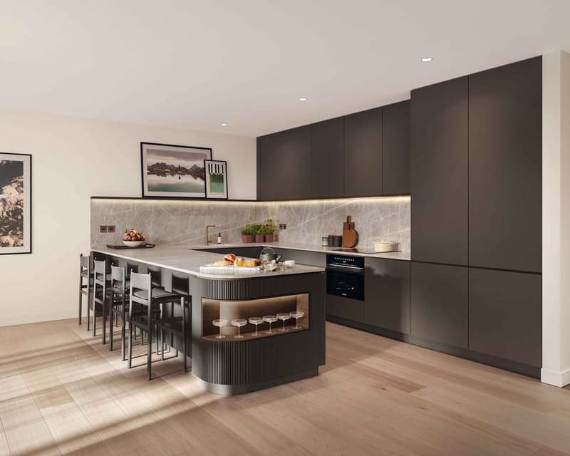 Modern kitchen with dark cabinets, marble countertops, large island with seating, hardwood floors, and artwork on the walls.