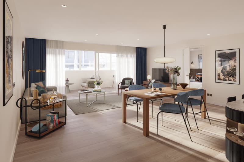 living room with open-plan kitchen, wooden table, wooden floor, large windows, blue curtains, art prints, grey couch, side table, shelves, wooden bench