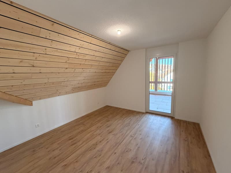 empty room, hardwood floor, wooden ceiling, glass door to balcony