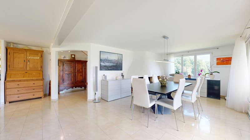 White dining table, chairs, wooden cabinet, white sideboard, paintings on the wall, wooden flooring, ceiling light