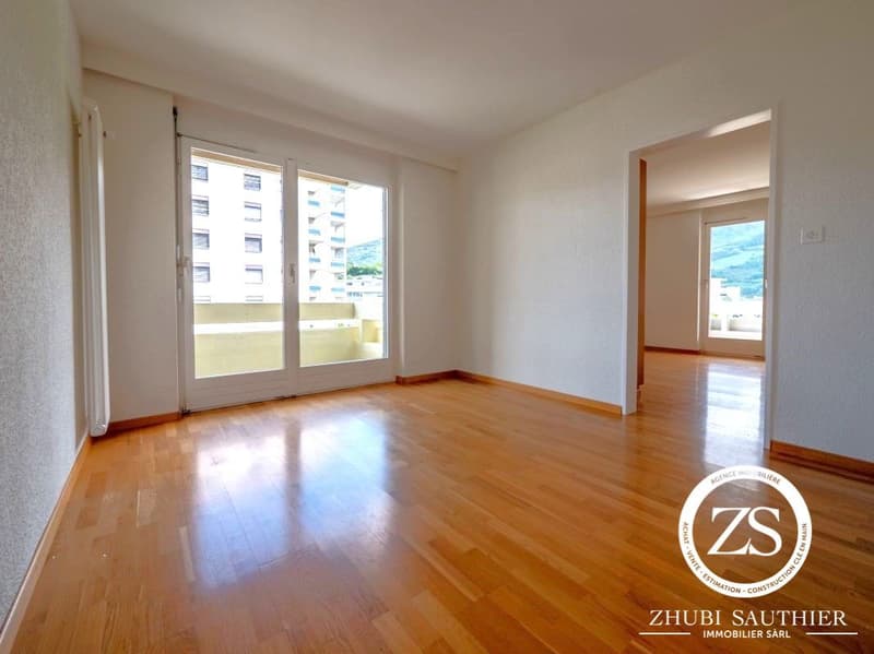 wooden floor, large windows, white walls, balcony, empty room