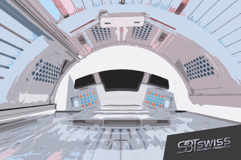 The image shows the interior of a futuristic-looking vehicle or spacecraft. The main focus is a large, curved windshield or display panel with various control panels and buttons surrounding it. The overall design has a sleek, high-tech aesthetic with a mi
