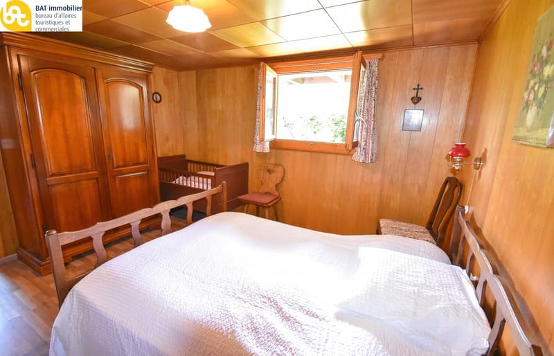 Wooden walls, bed, crib, wooden chair, closet