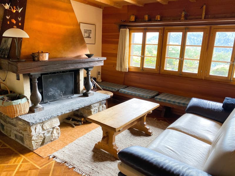 Fireplace, wooden bench, sofa, wooden coffee table, basket, windows, wooden floor, lamp