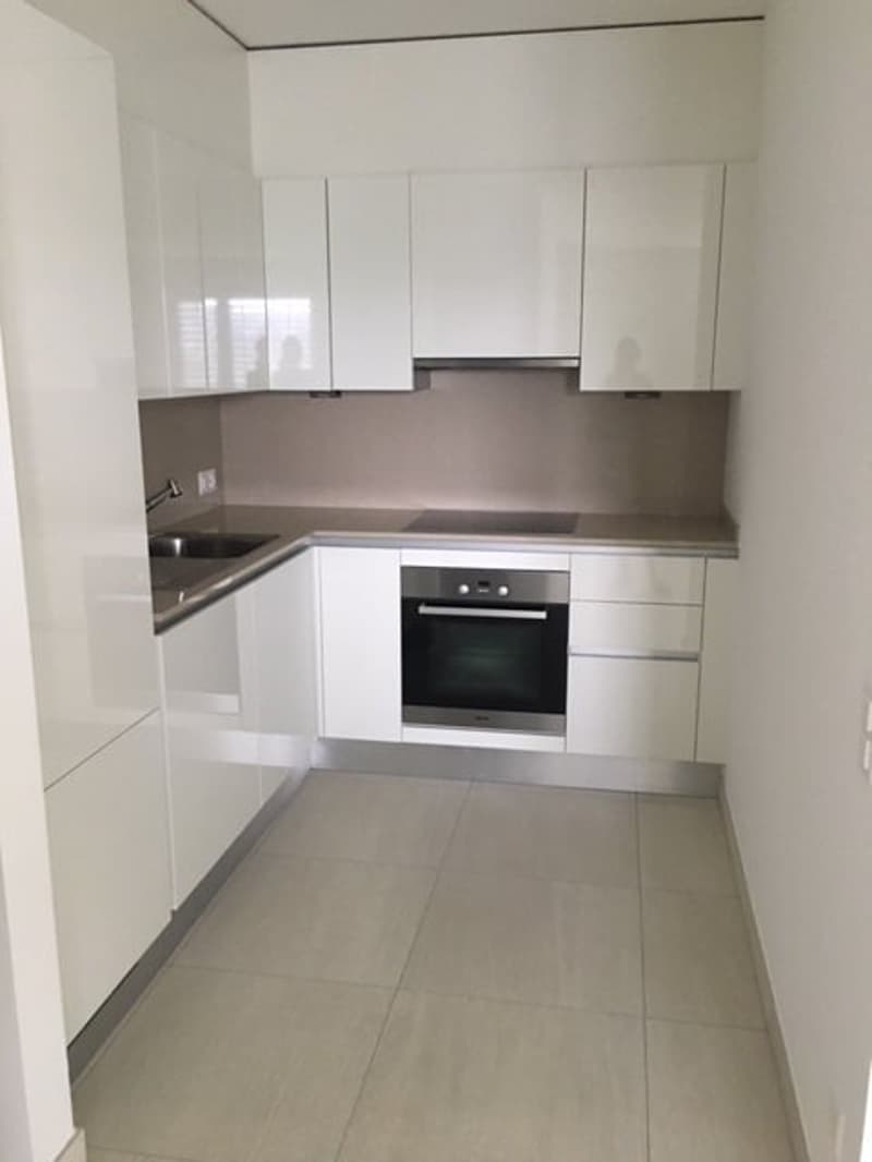 modern kitchen, white cabinets, stainless steel appliances, tiled floor, sink, electric stove